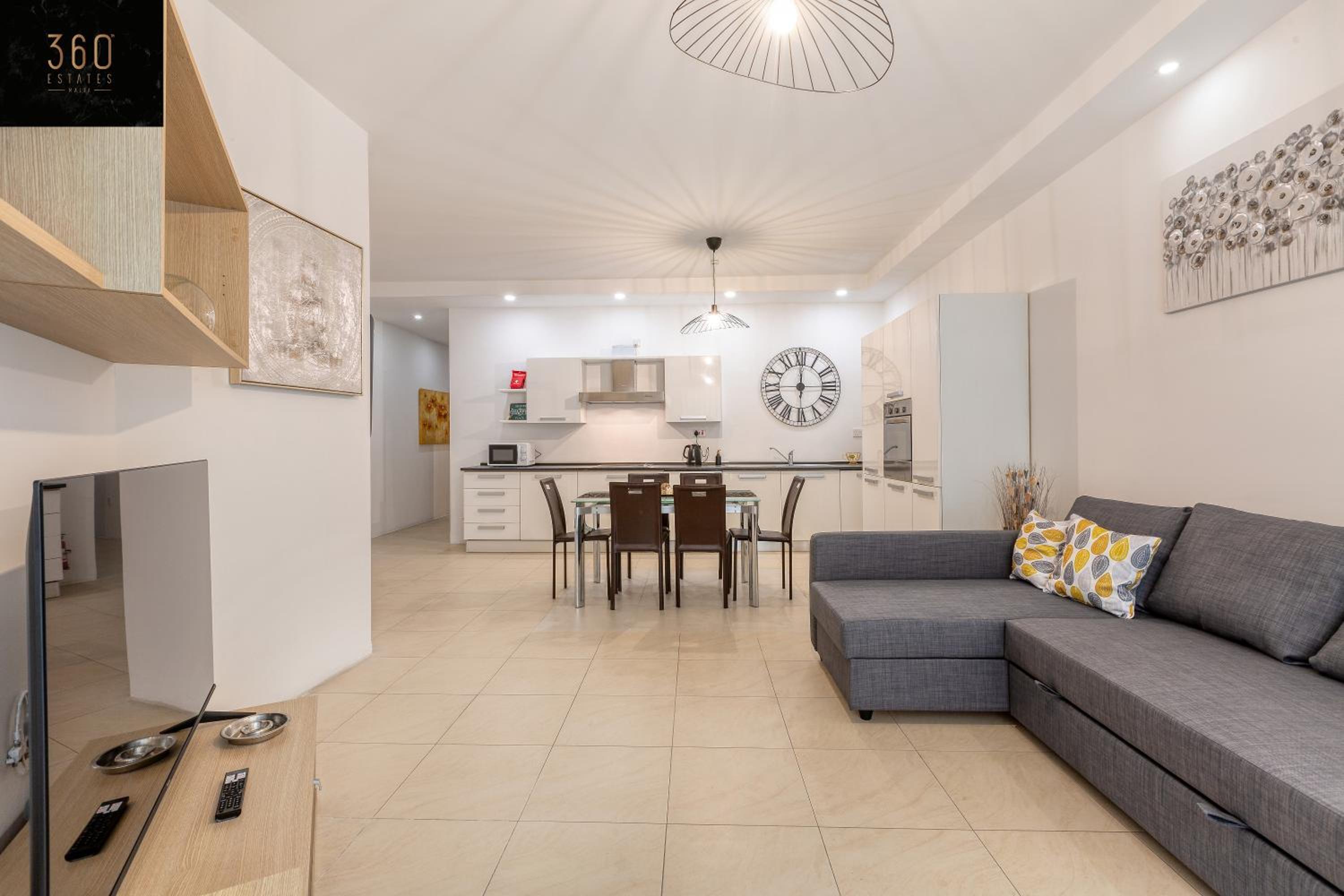 Wonderful, designer 2BR home with large Sofa & TV by 360 Estates photo 5