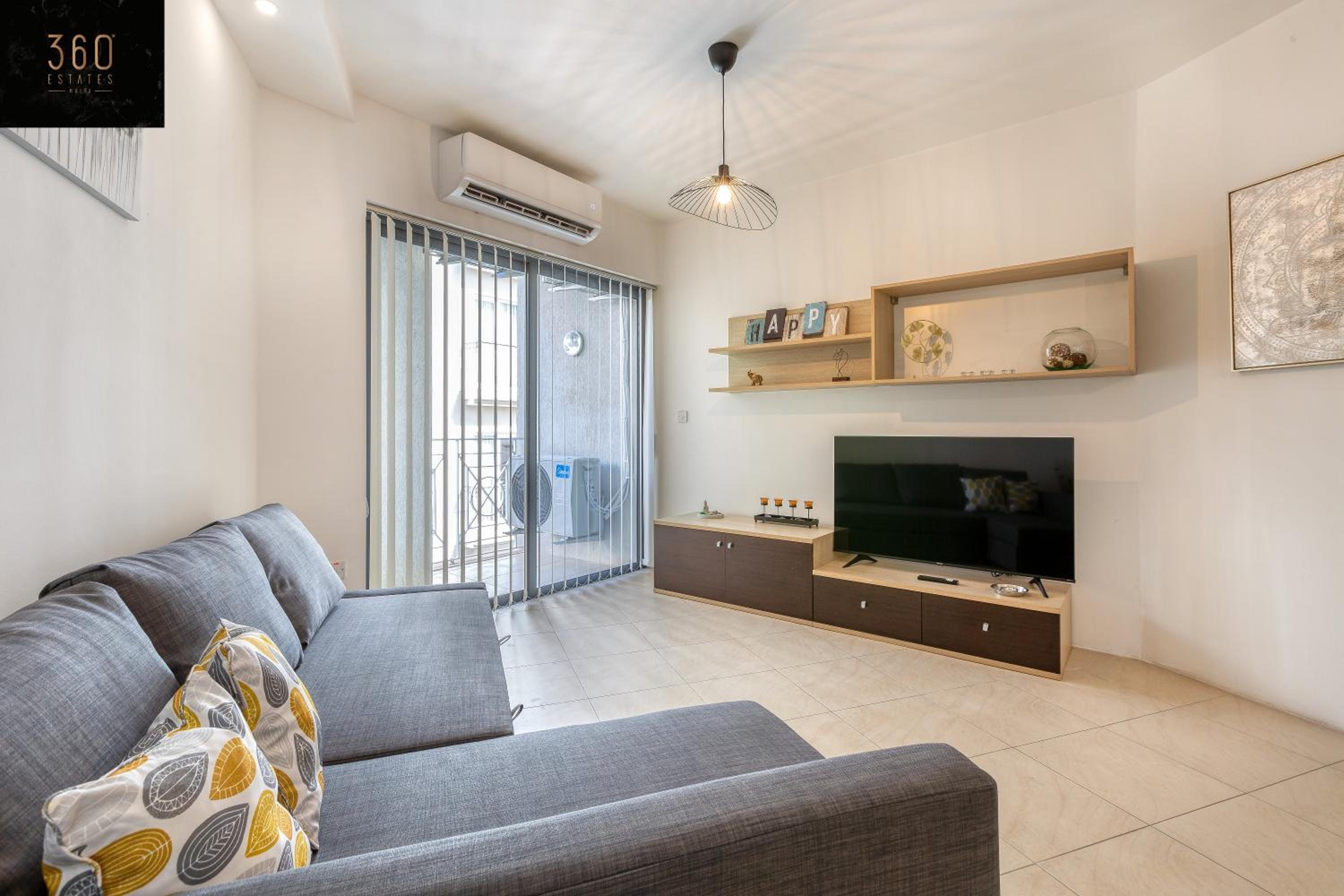 Wonderful, designer 2BR home with large Sofa & TV by 360 Estates photo 2