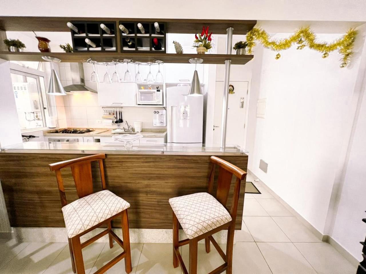 Home 43| Apto em cond Pé na Areia em Bertioga