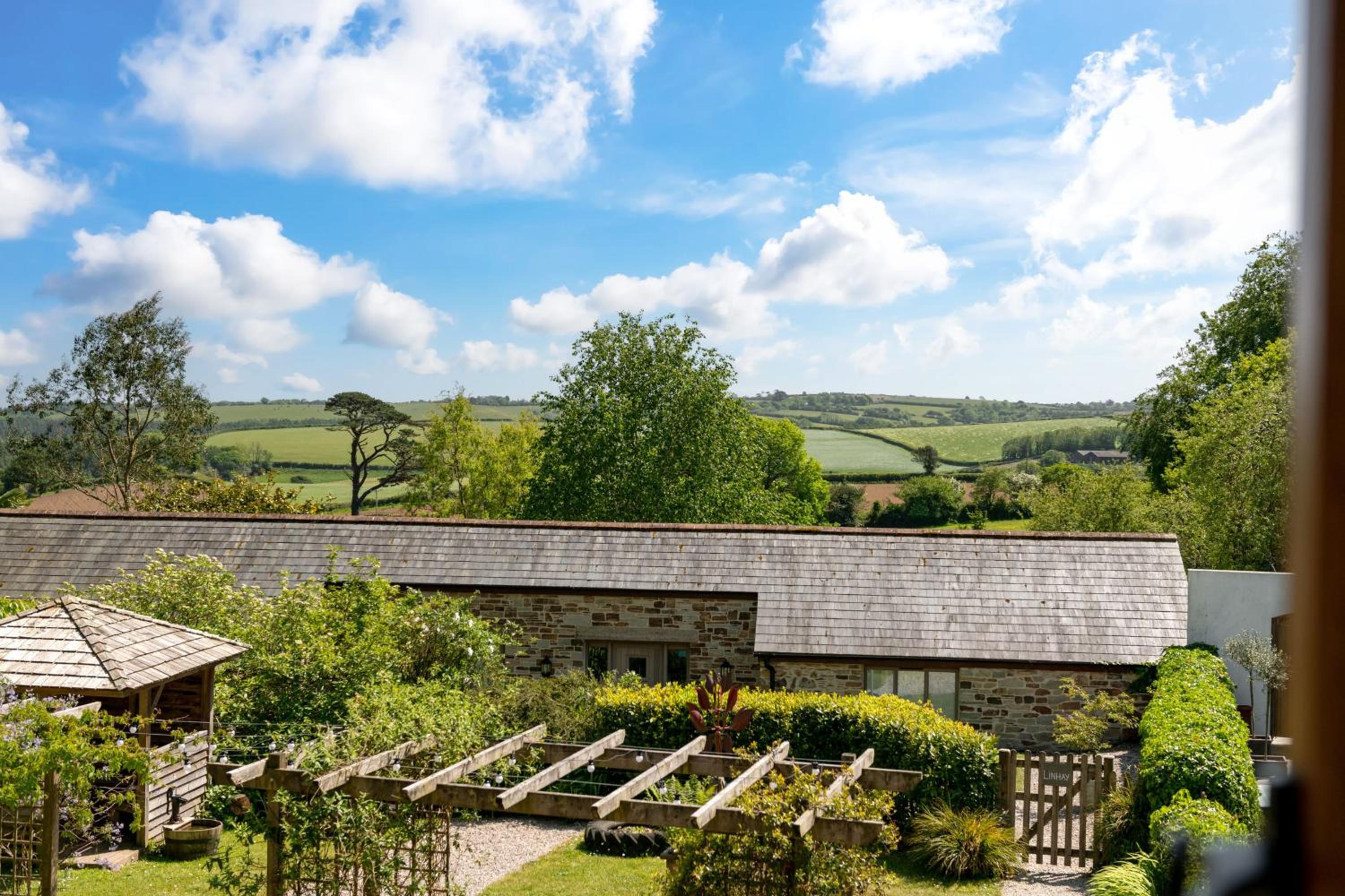 Linhay at East Trenean Farm -Luxury retreat for 2 with stunning rural views, private hot tub and EV charging view 3