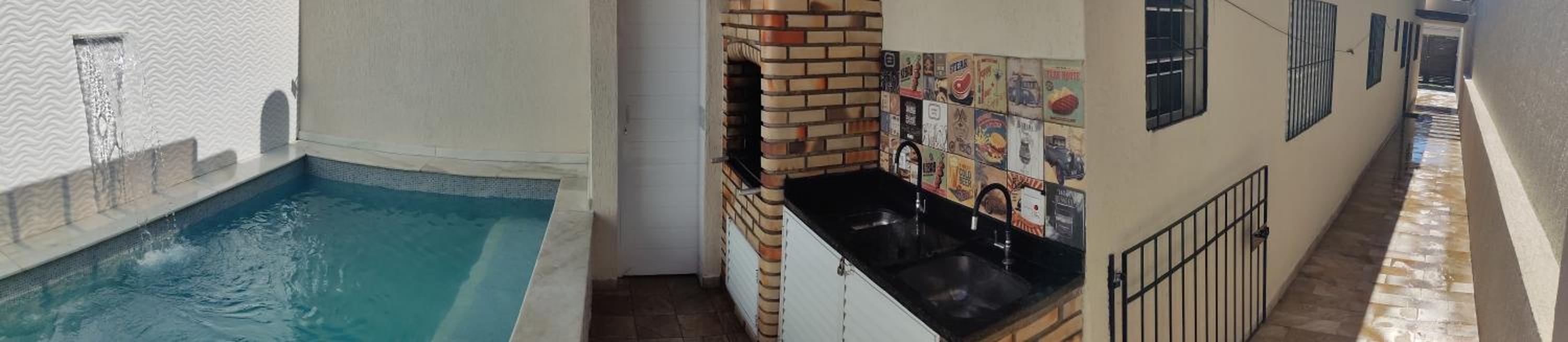 A Casa Linda Com Piscina Aquecida churrasqueira wifi pertinho da praia em Itanhaém