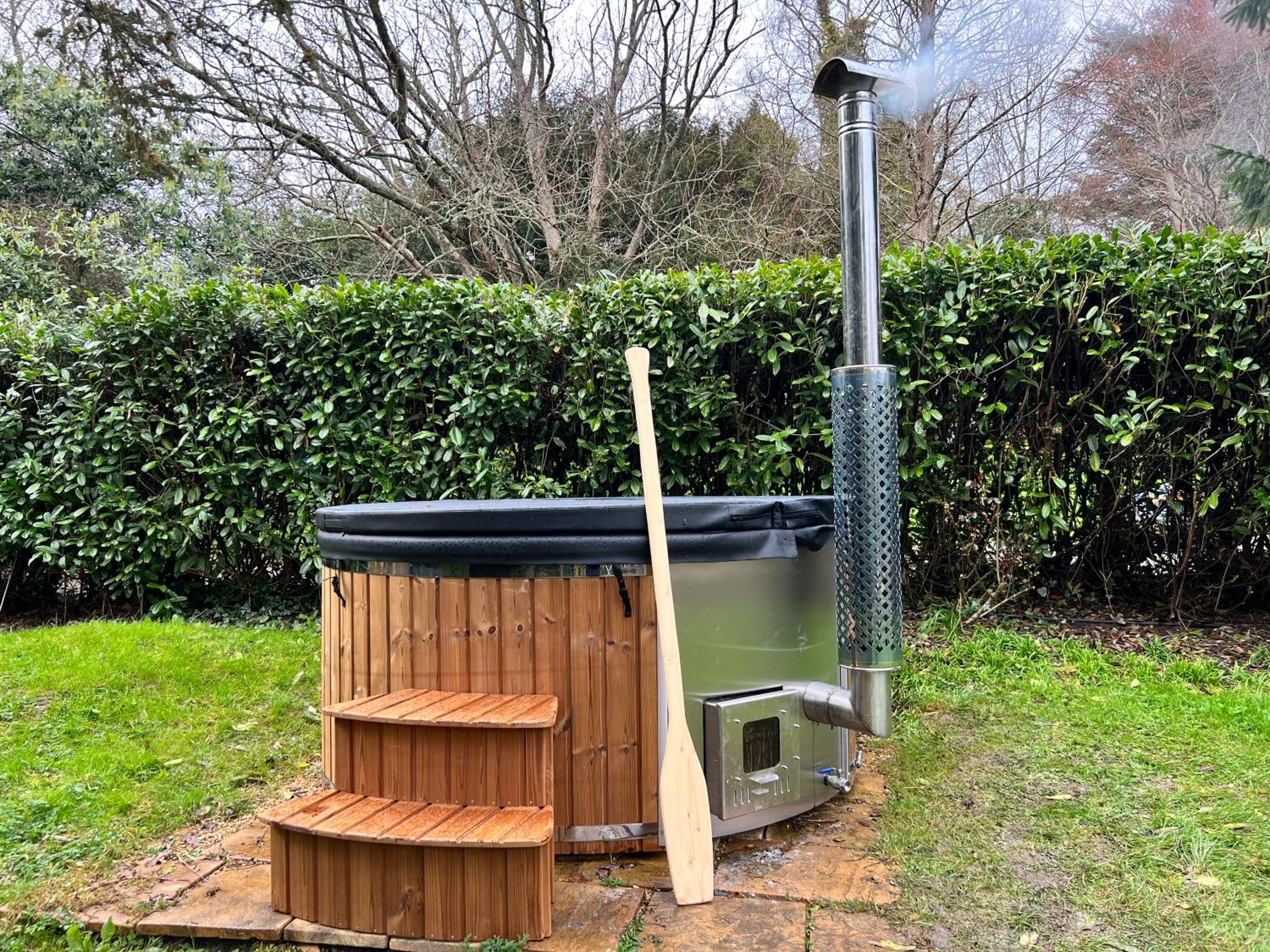 Refurbished coach house with pool & wood fired hot tub view 2