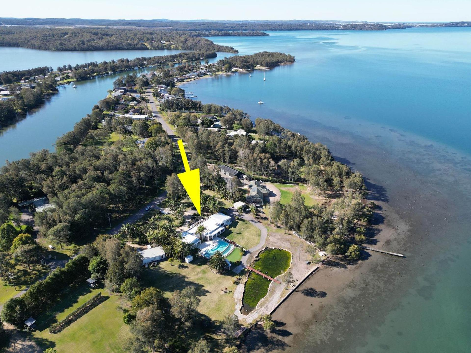 Lake Palm Resort Luxury Retreat absolute Waterfront on 3 acres at Lake Macquarie.