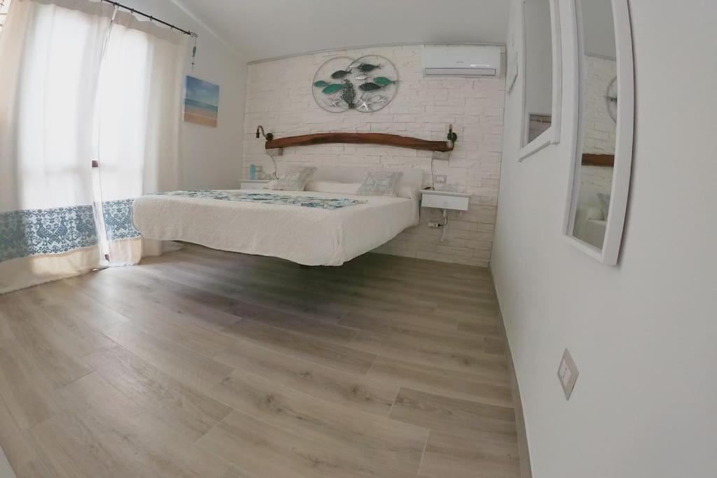 Oasi del Relax - Seaside Peaceful Panoramic Terrace in ITALY - new Sardinia apartment 50 mt beach&sea full comfort air conditioning-WiFi-Parking-Privacy
