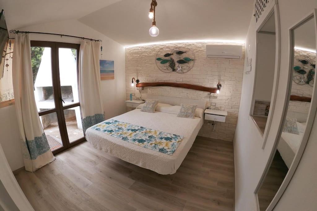Oasi del Relax - Seaside Peaceful Panoramic Terrace in ITALY - new Sardinia apartment 50 mt beach&sea full comfort air conditioning-WiFi-Parking-Privacy