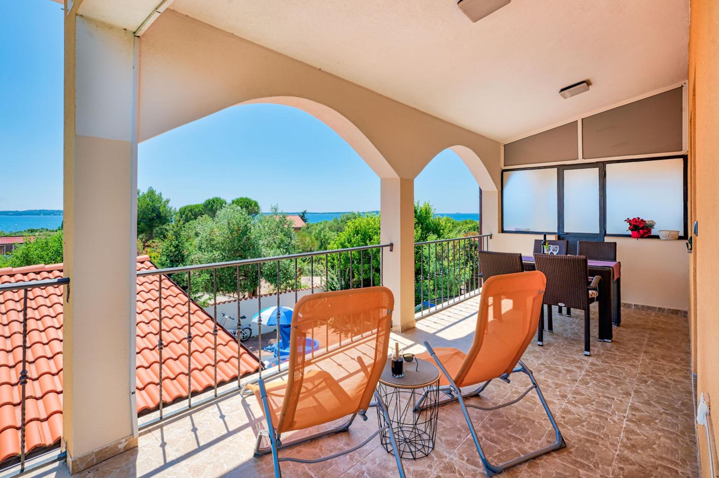 Teuta Apartments - a beach and a sea view