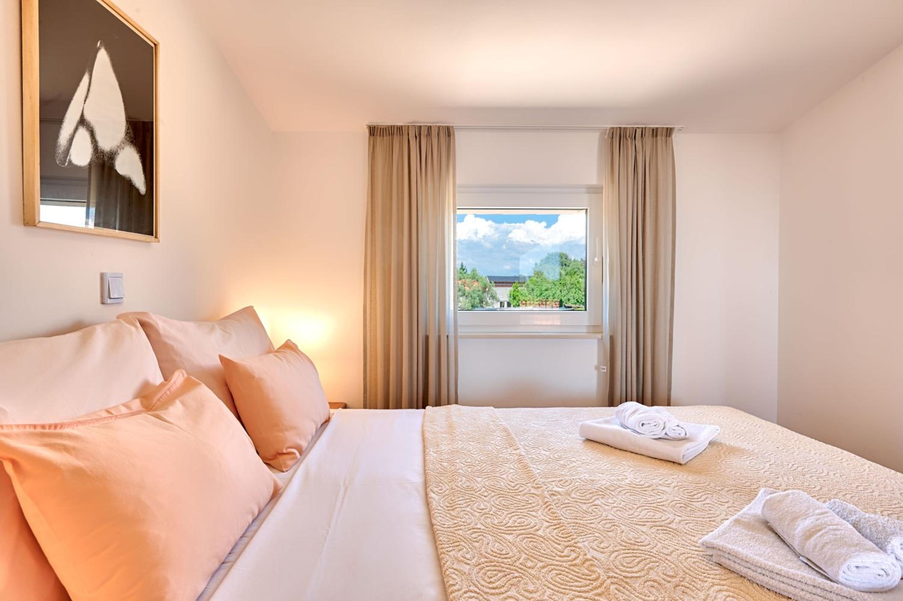 Teuta Apartments - a beach and a sea view