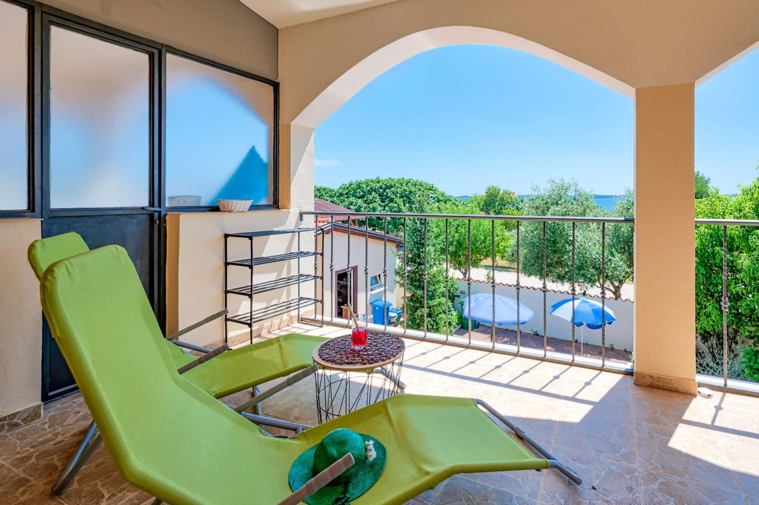 Teuta Apartments - a beach and a sea view