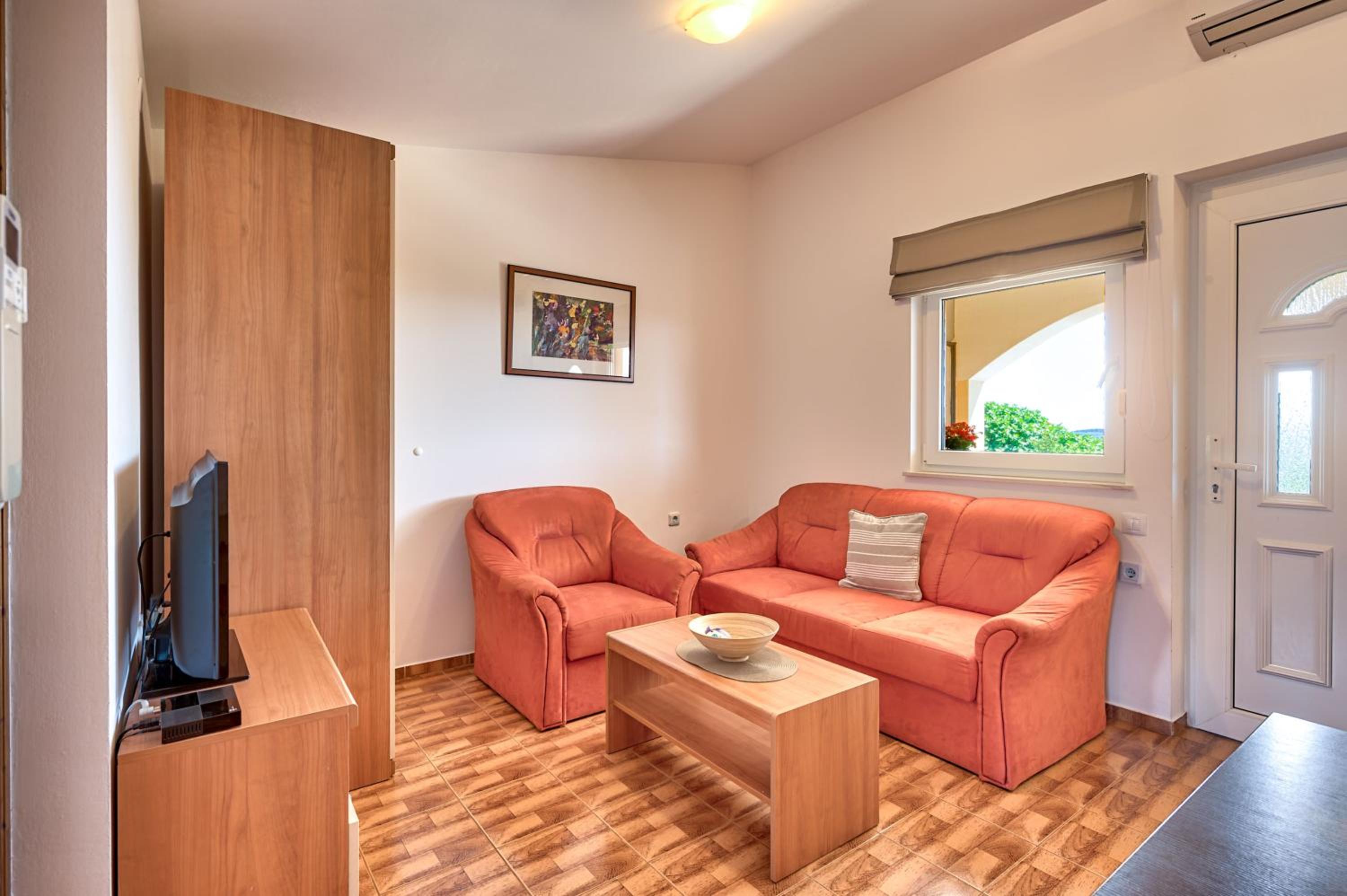 Teuta Apartments - a beach and a sea view