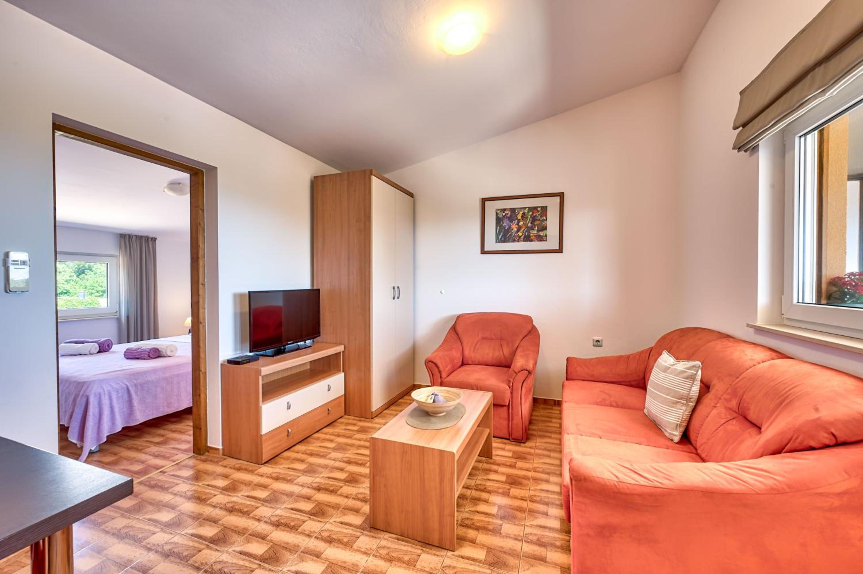 Teuta Apartments - a beach and a sea view