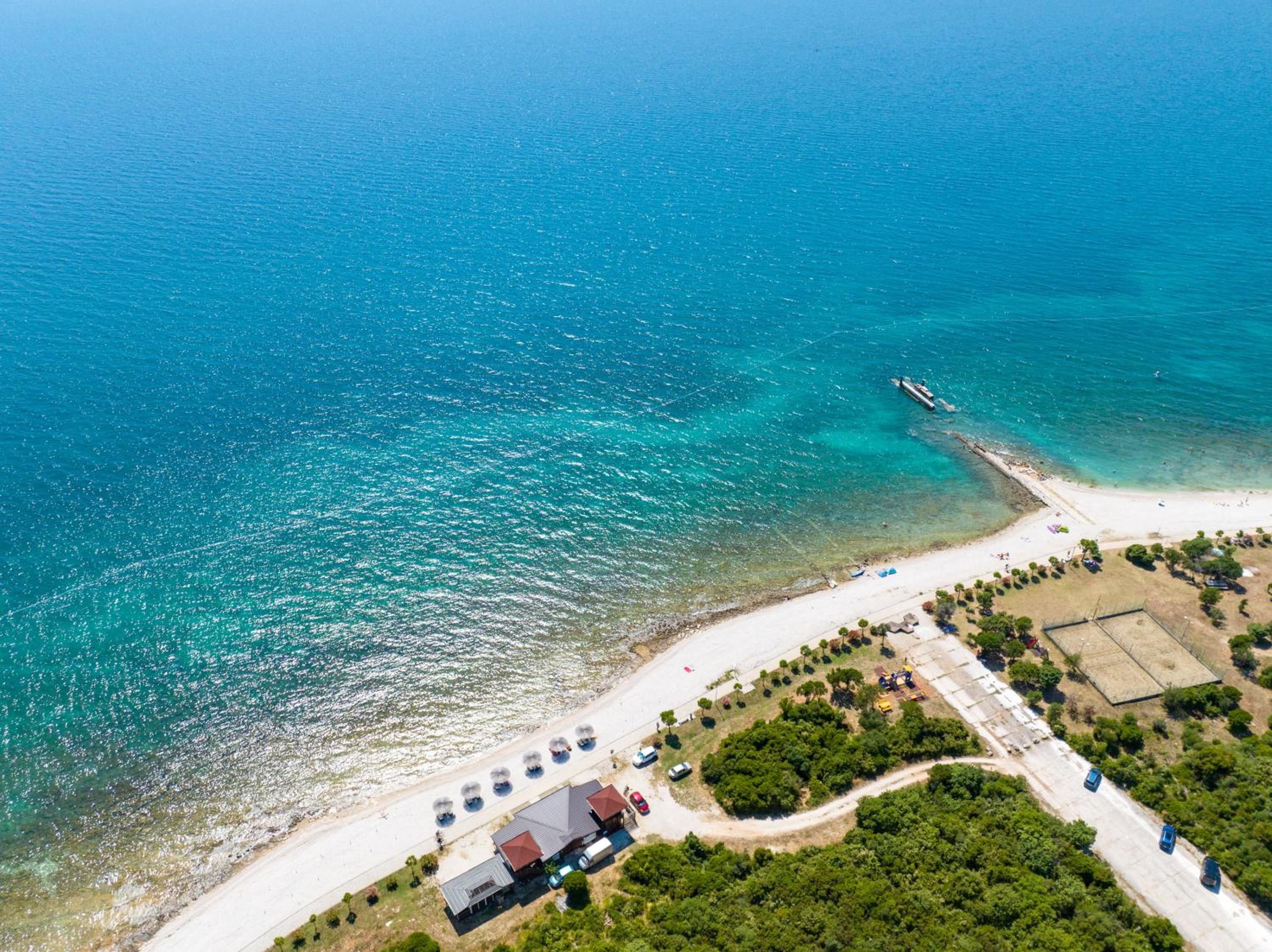 Teuta Apartments - a beach and a sea view