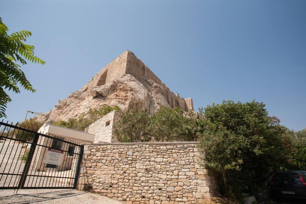 At the foot of Acropolis.