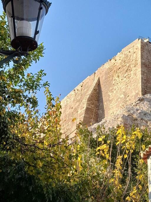 At the foot of Acropolis.