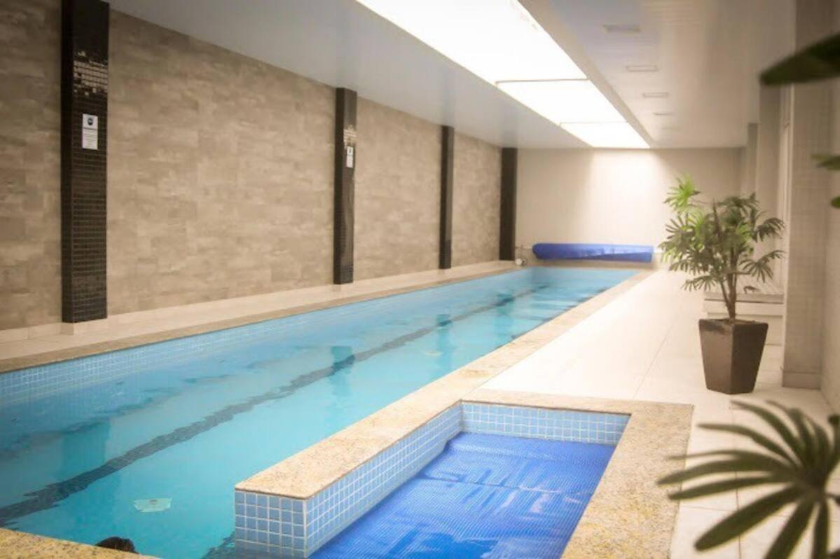 Lindo studio equipado em apartamento clube com academia e conforto no centro de Curitiba - MID Home