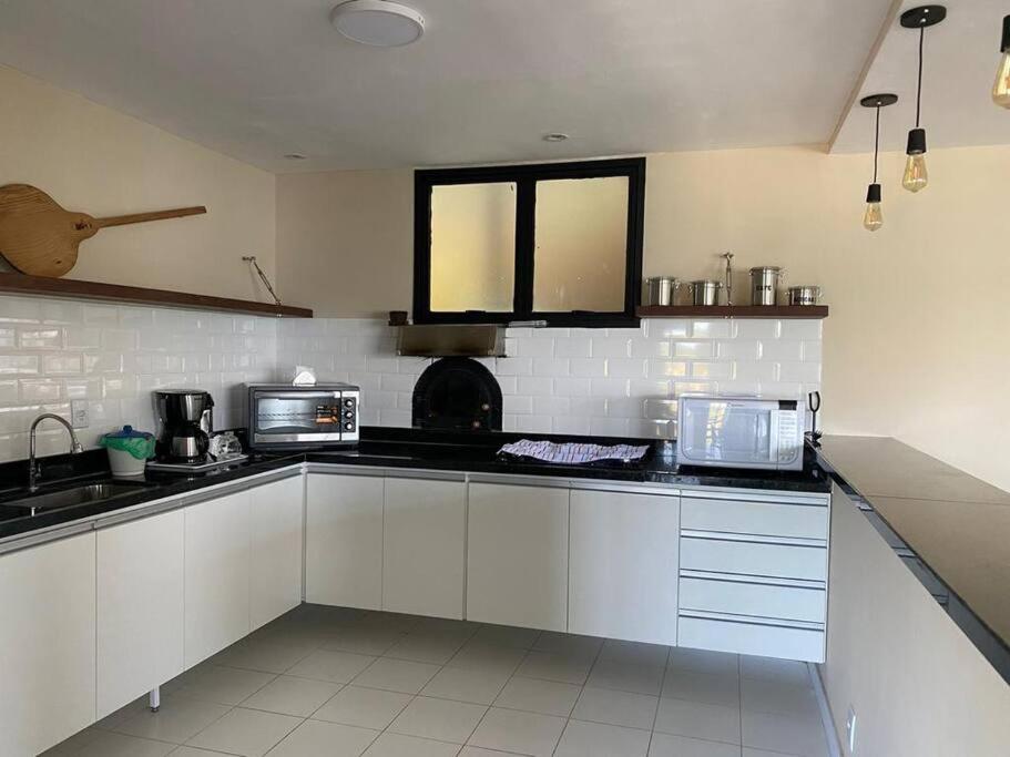 Casa Laranja em Condomínio Pé na Areia