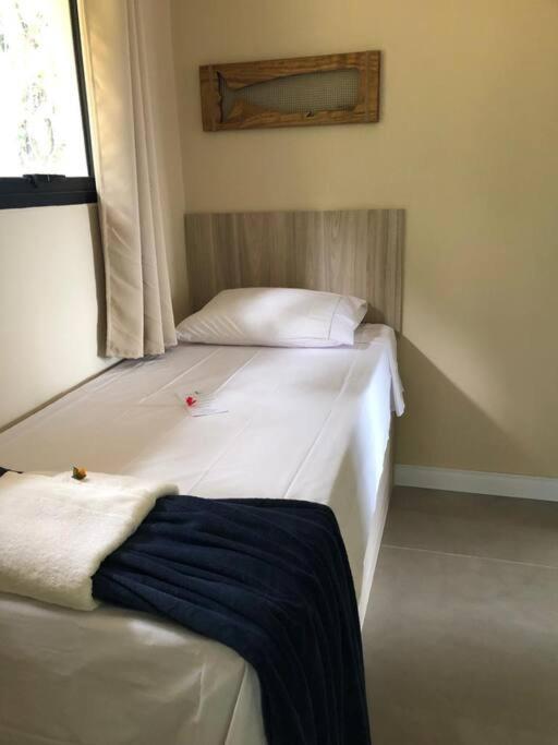 Casa Laranja em Condomínio Pé na Areia