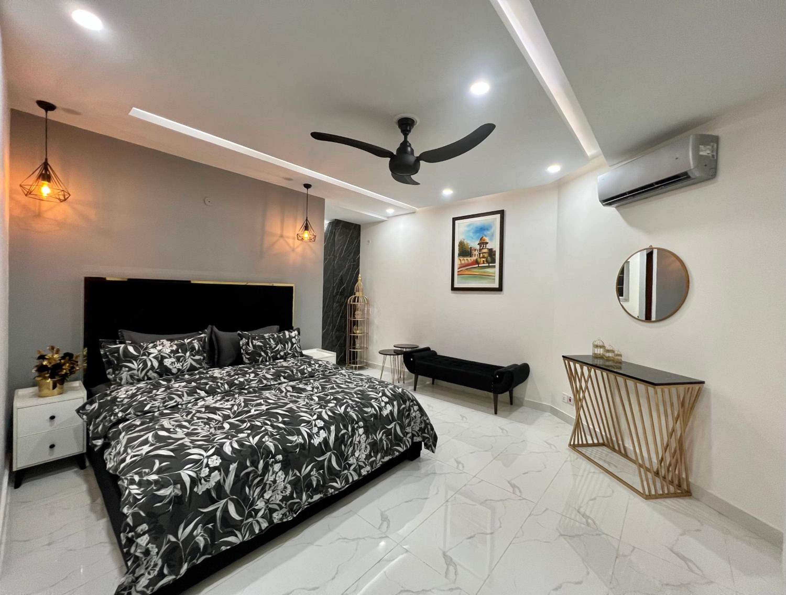 Chic Noir 1 Bedroom Apartment Gulberg view 2