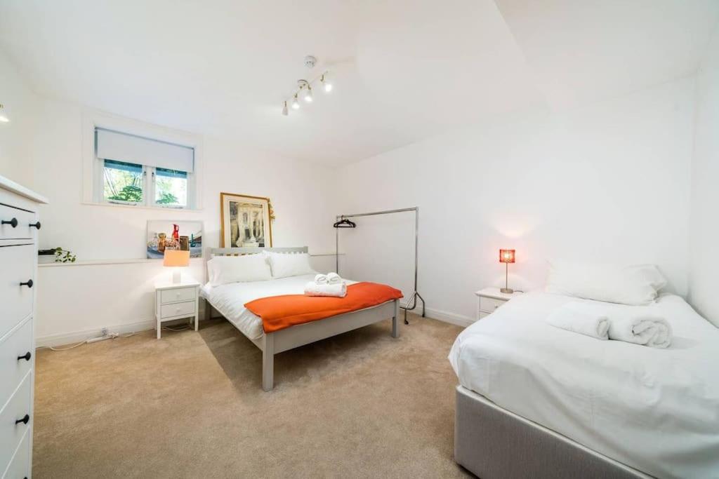 Elegant 2-Bedroom Getaway w Terrace & Garden Views