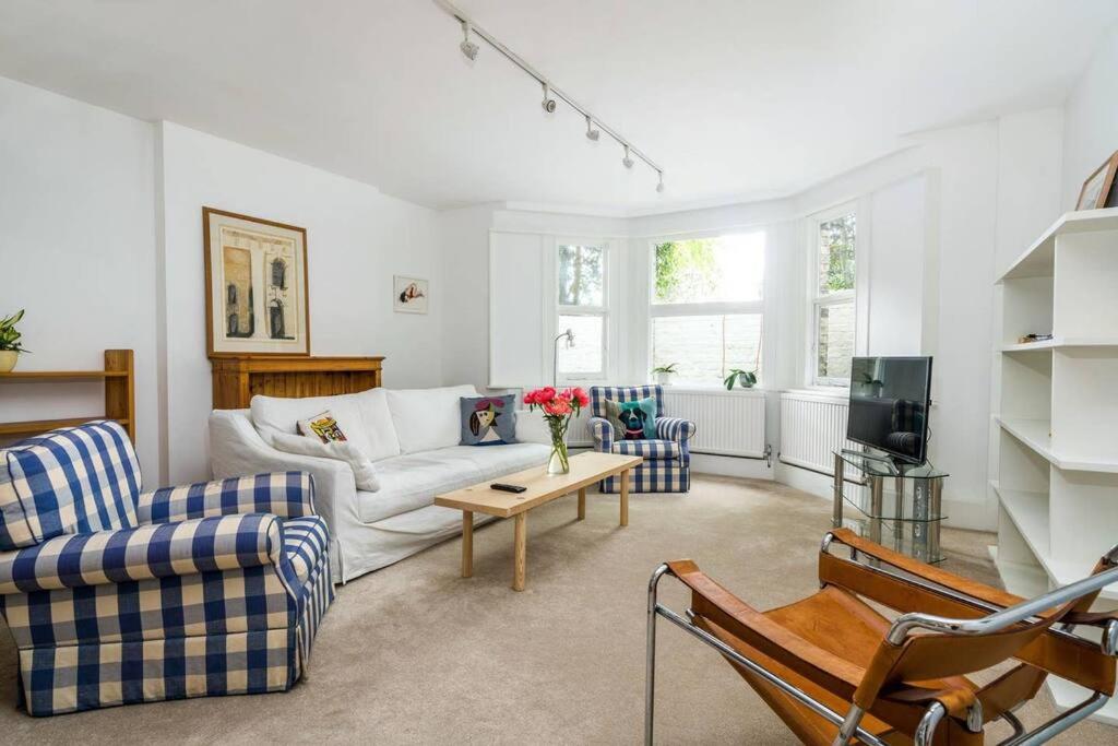 Elegant 2-Bedroom Getaway w Terrace & Garden Views