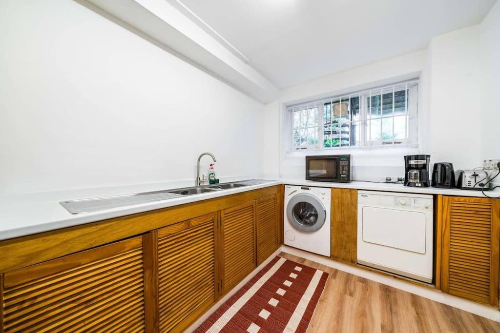 Elegant 2-Bedroom Getaway w Terrace & Garden Views