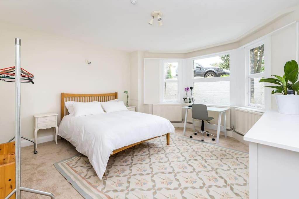 Elegant 2-Bedroom Getaway w Terrace & Garden Views
