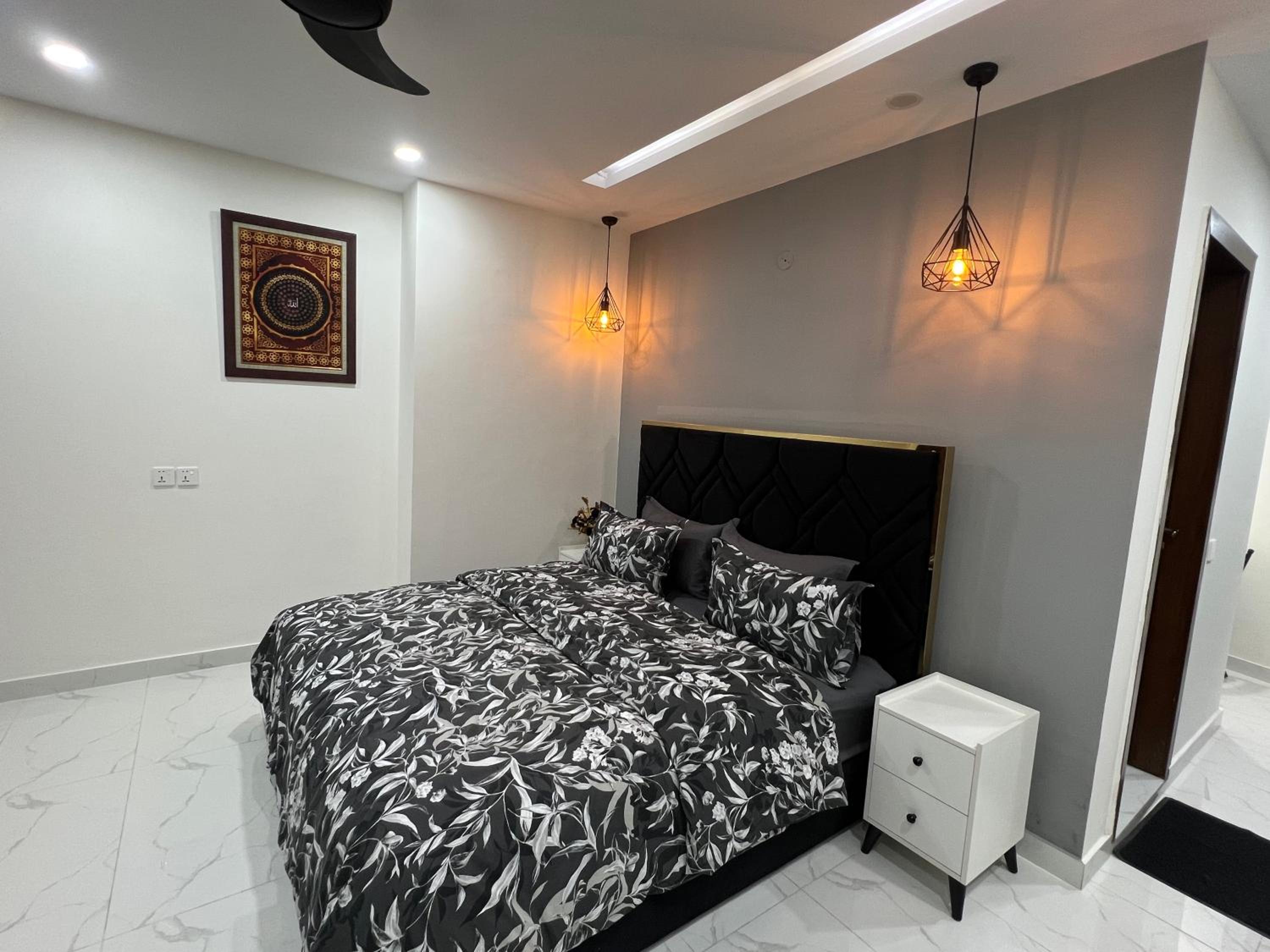 Chic Noir 1 Bedroom Apartment Gulberg view 4