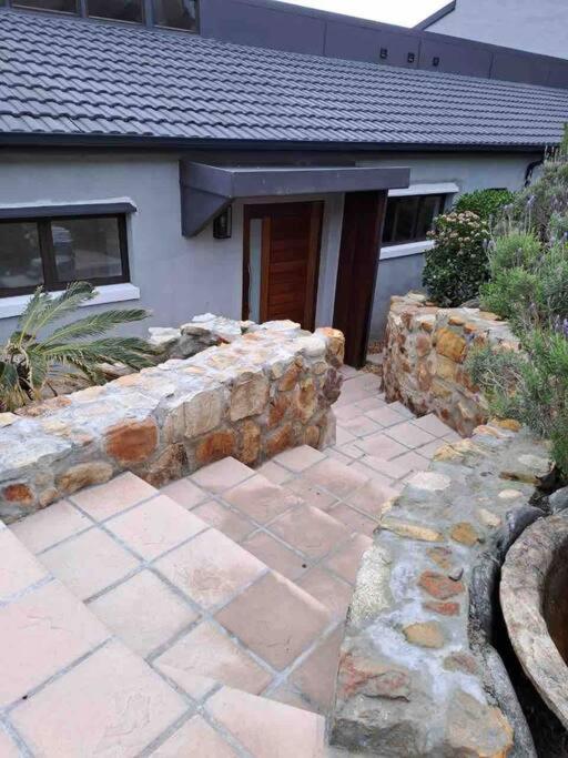Modern mountainside home with ocean view - Minimal load shedding