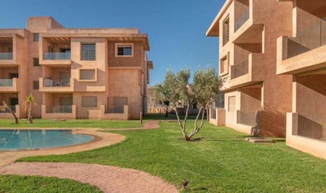 An elegant apartment for rent with a pool and a view of the mountains in Marrakesh