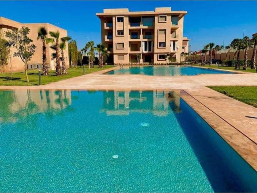 An elegant apartment for rent with a pool and a view of the mountains in Marrakesh