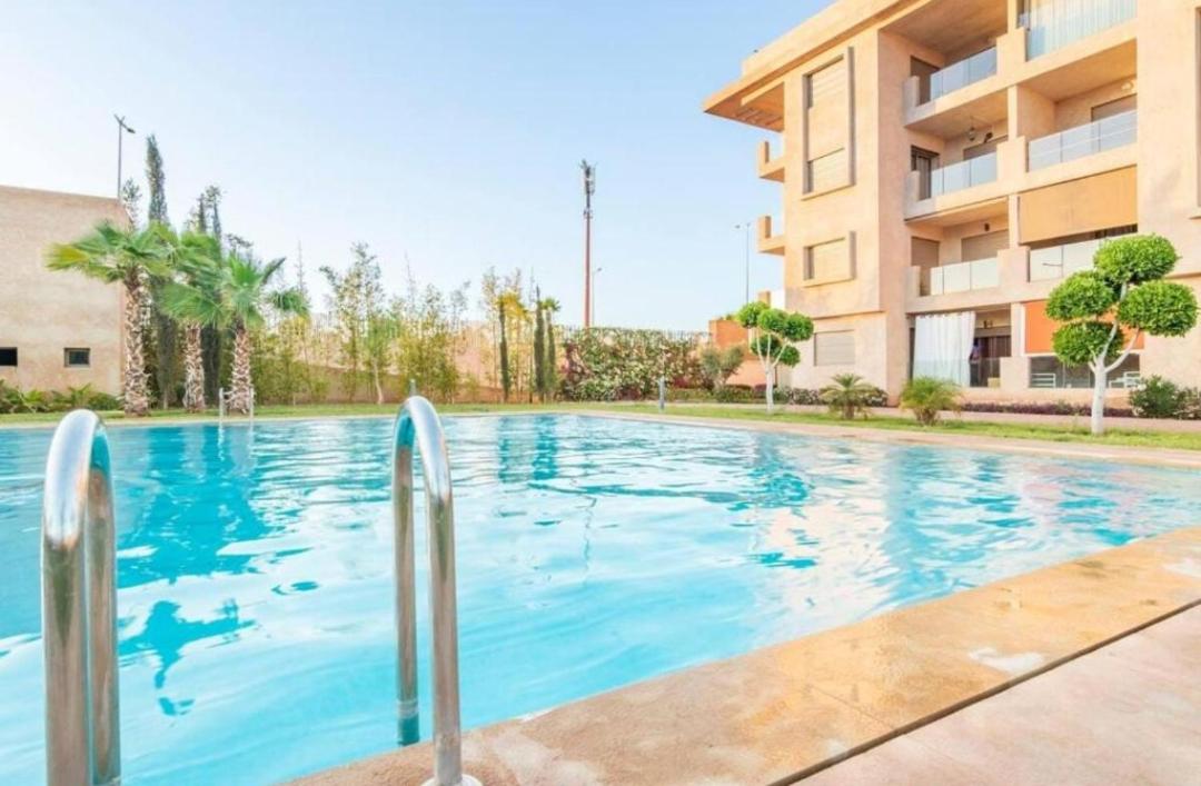 An elegant apartment for rent with a pool and a view of the mountains in Marrakesh