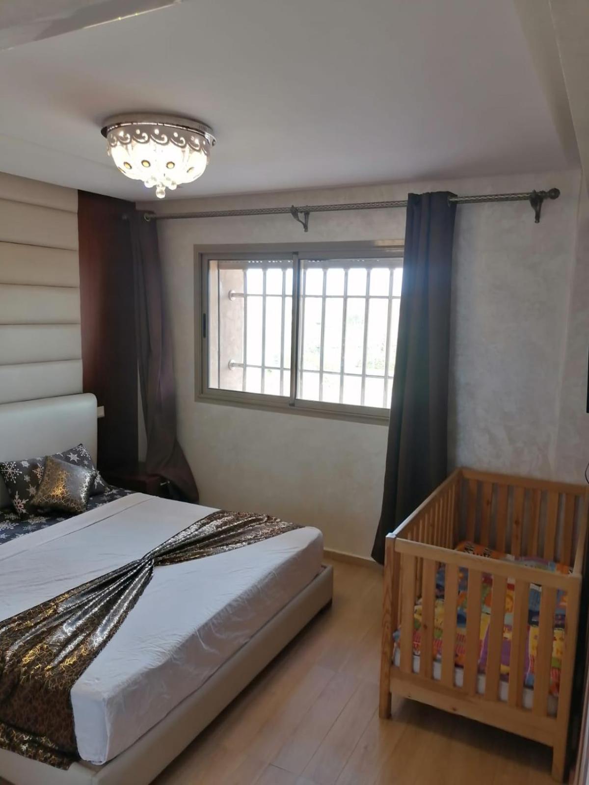 An elegant apartment for rent with a pool and a view of the mountains in Marrakesh