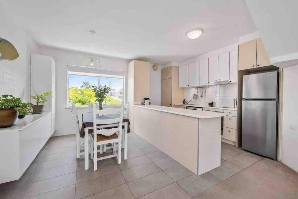 Beautiful, modern apartment seconds from beach