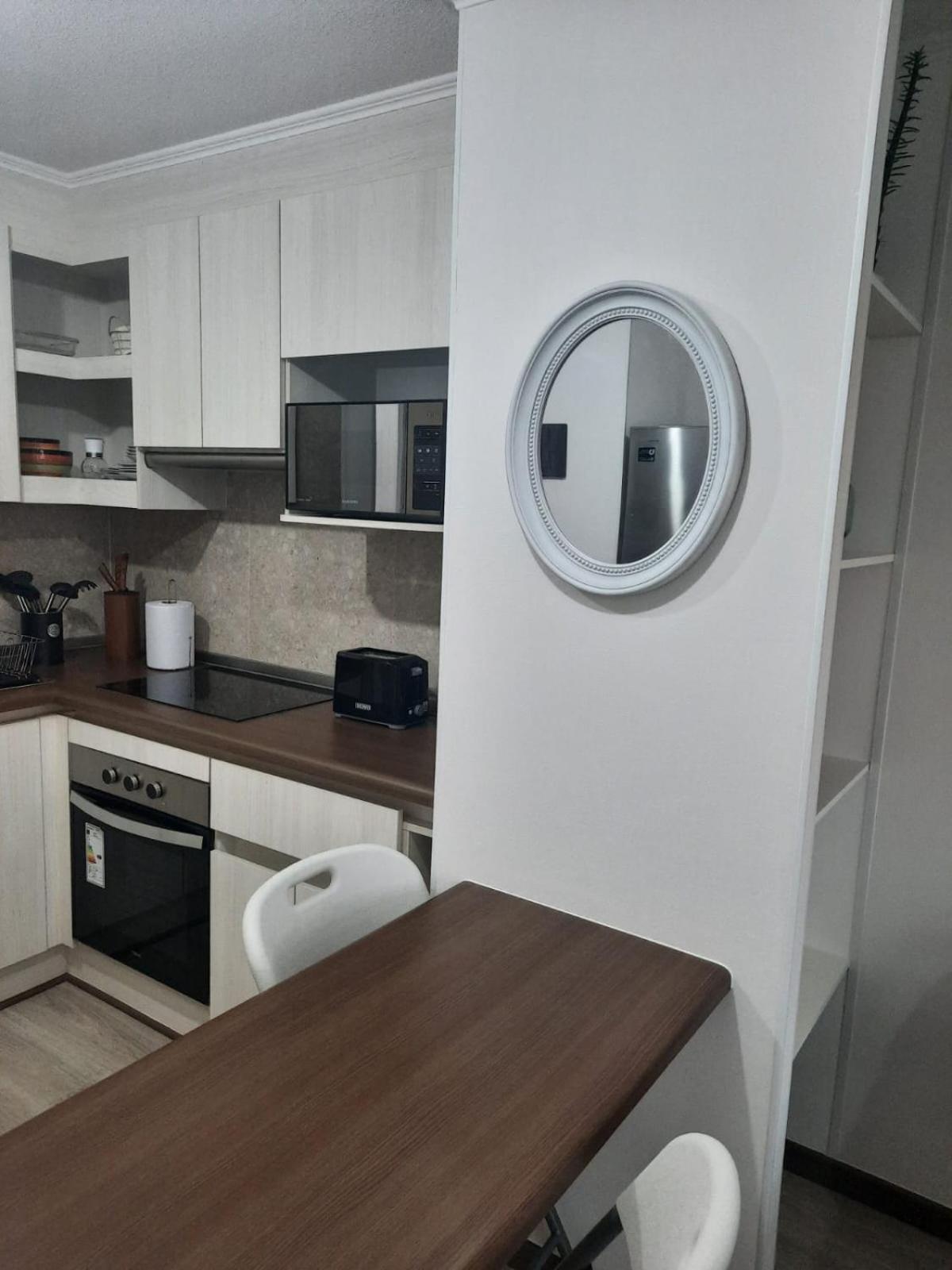Acogedor Departamento Central con Piscina, Estacionamiento Privado y Más