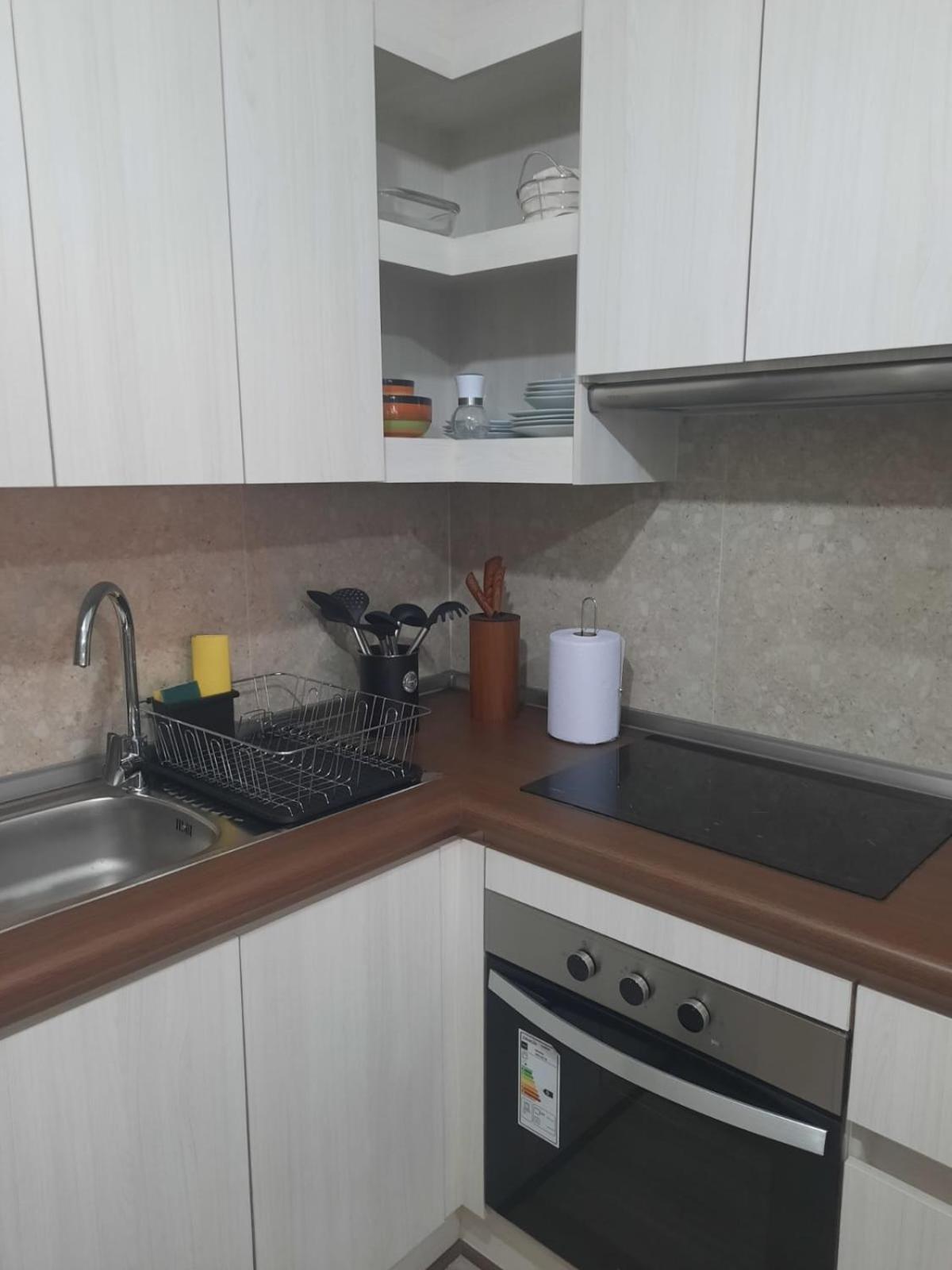 Acogedor Departamento Central con Piscina, Estacionamiento Privado y Más