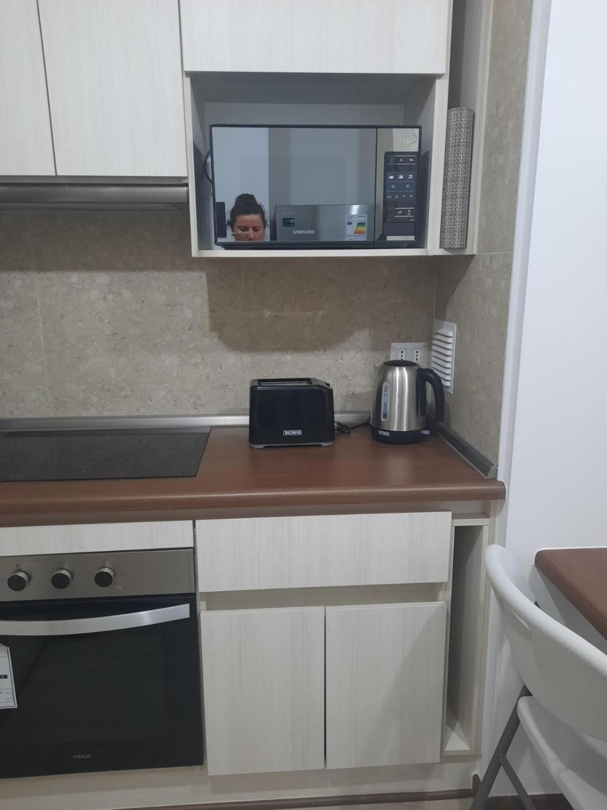 Acogedor Departamento Central con Piscina, Estacionamiento Privado y Más