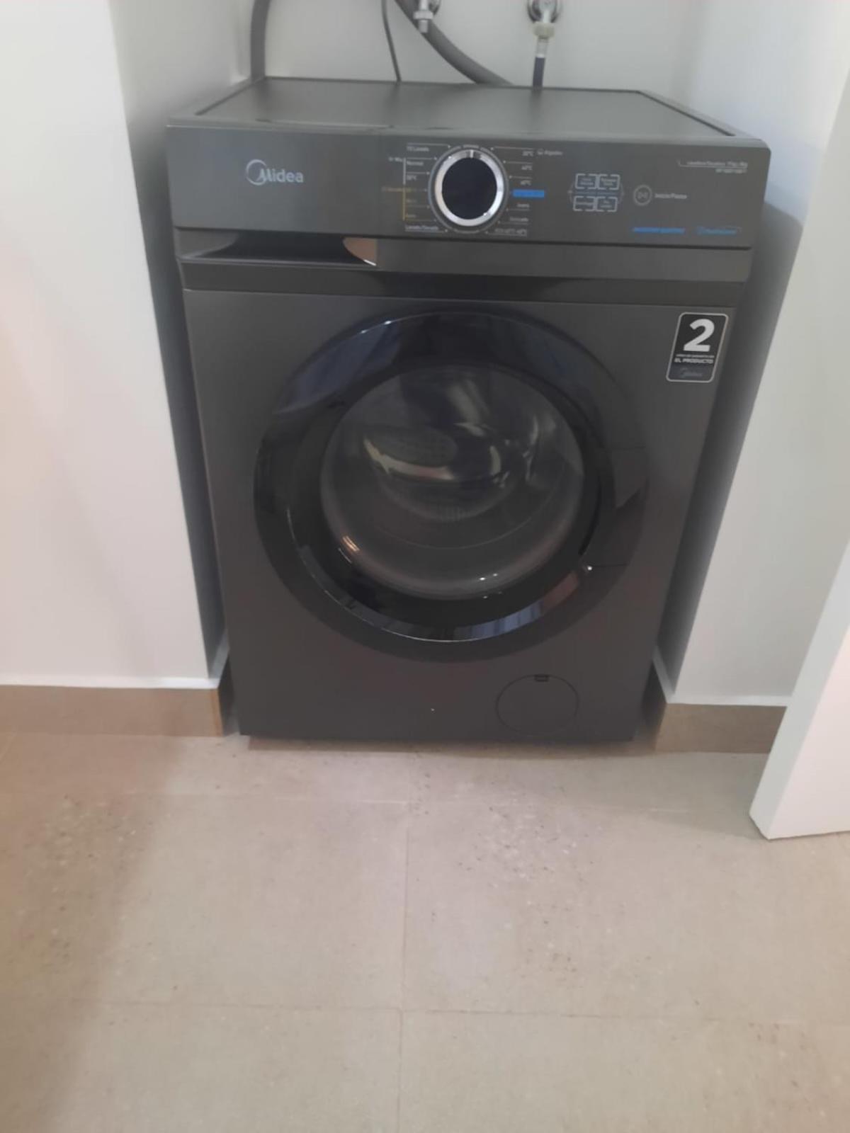 Acogedor Departamento Central con Piscina, Estacionamiento Privado y Más