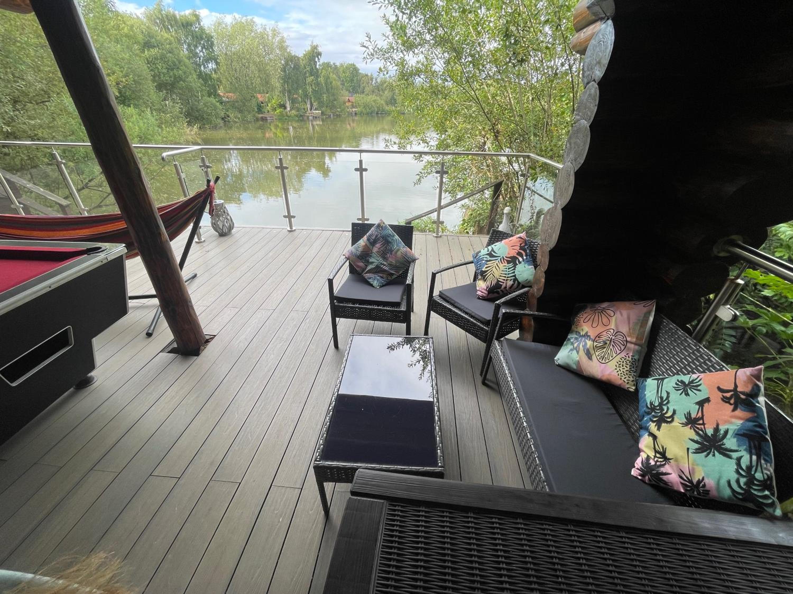 Woodpecker Log Cabin with hot tub, pizza oven bbq entertainment area, lakeside with private fishing peg situated at Tattershall Lakes view 5
