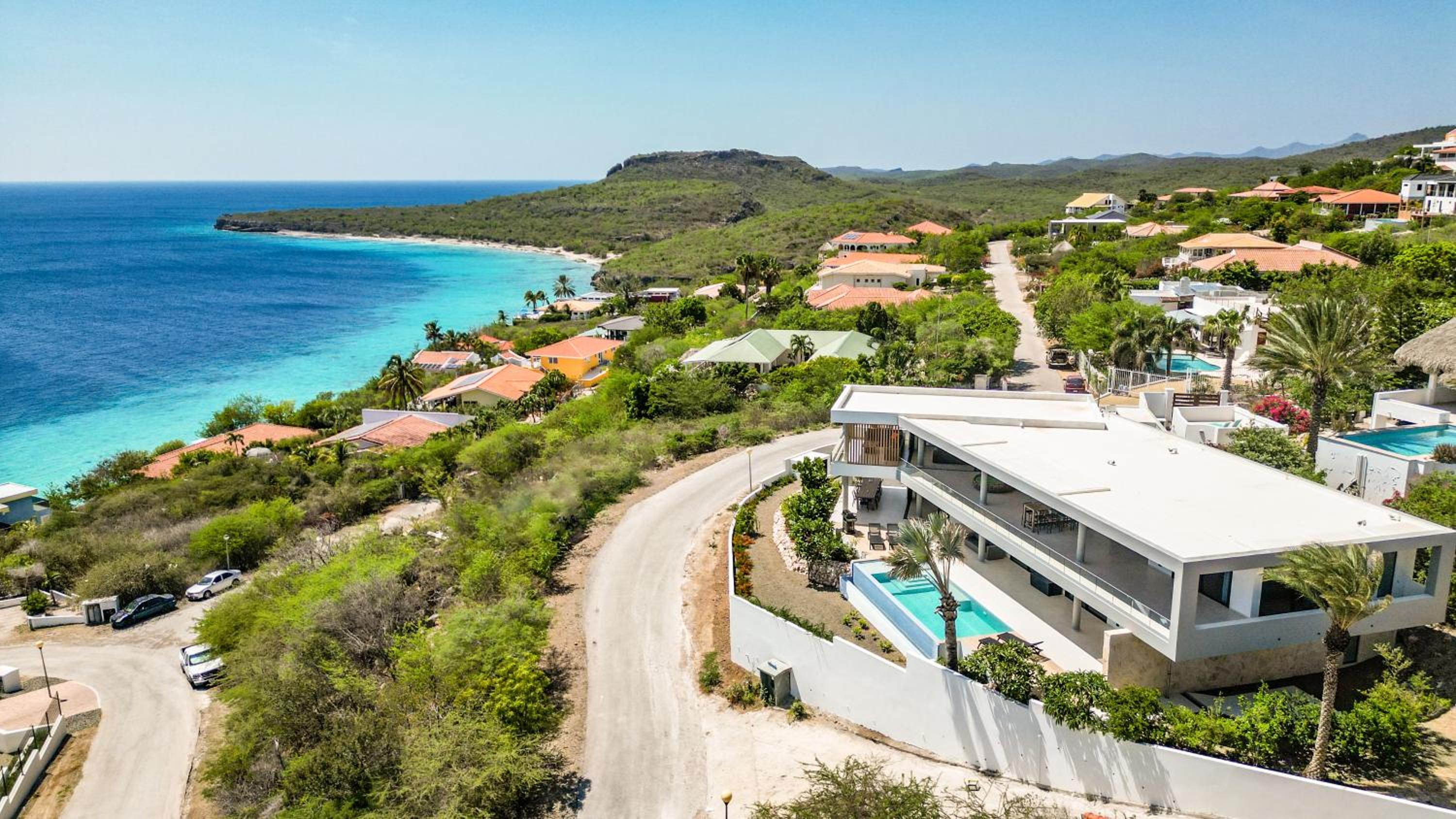 Luxury 12-Guest Villa in Gated Community with Pool, Ocean View & Private Beach Access