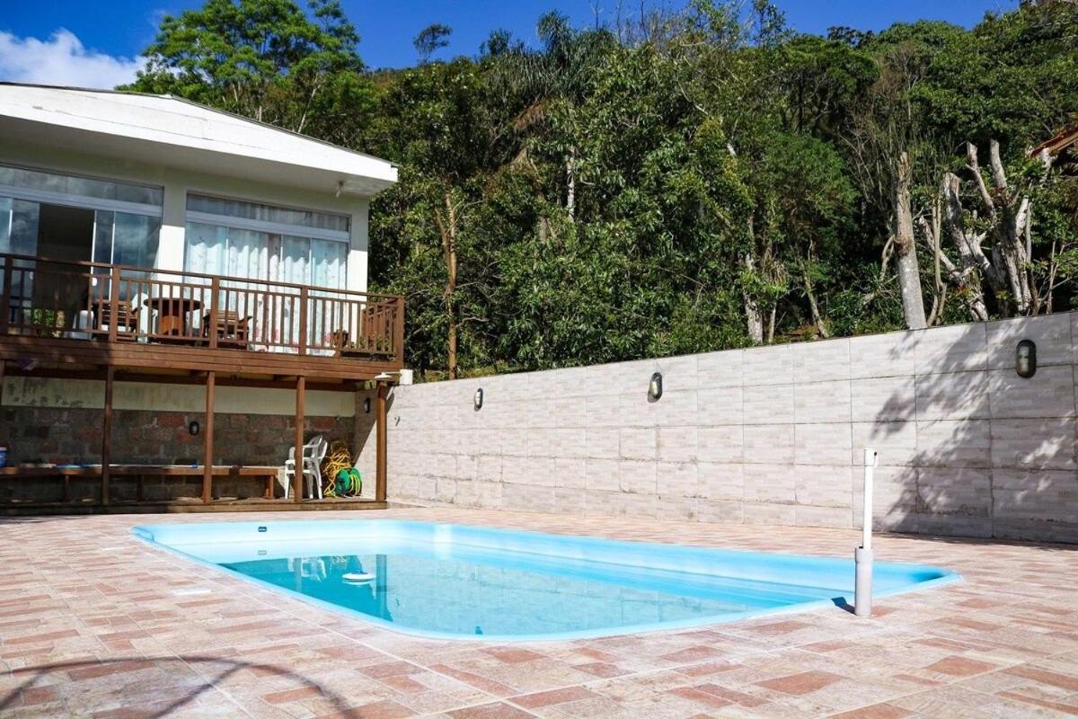 Casa com piscina vista mar por do sol