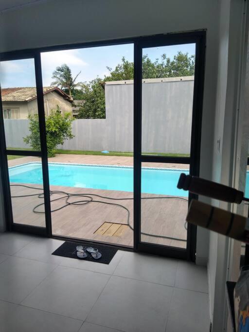 Aconchegante casa de Madeira com linda área lazer!