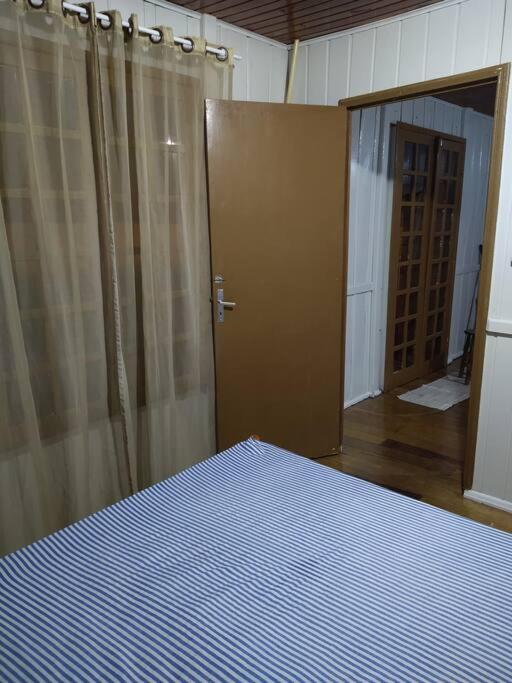 Aconchegante casa de Madeira com linda área lazer!