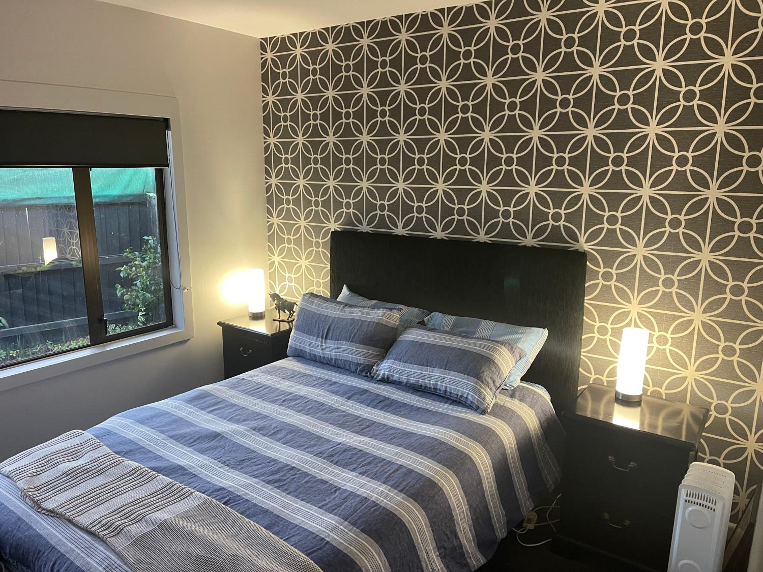Kaiapoi Village House Deluxe bedroom and bathroom