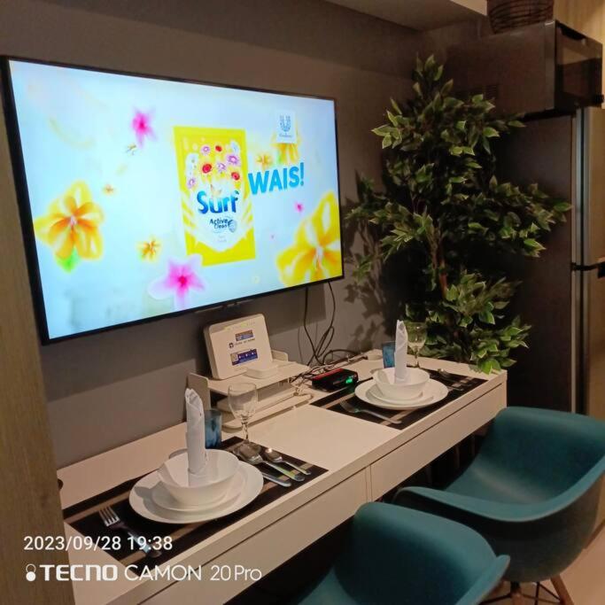 Cozy New 1BR Fame Residences Condo with Balcony view 5