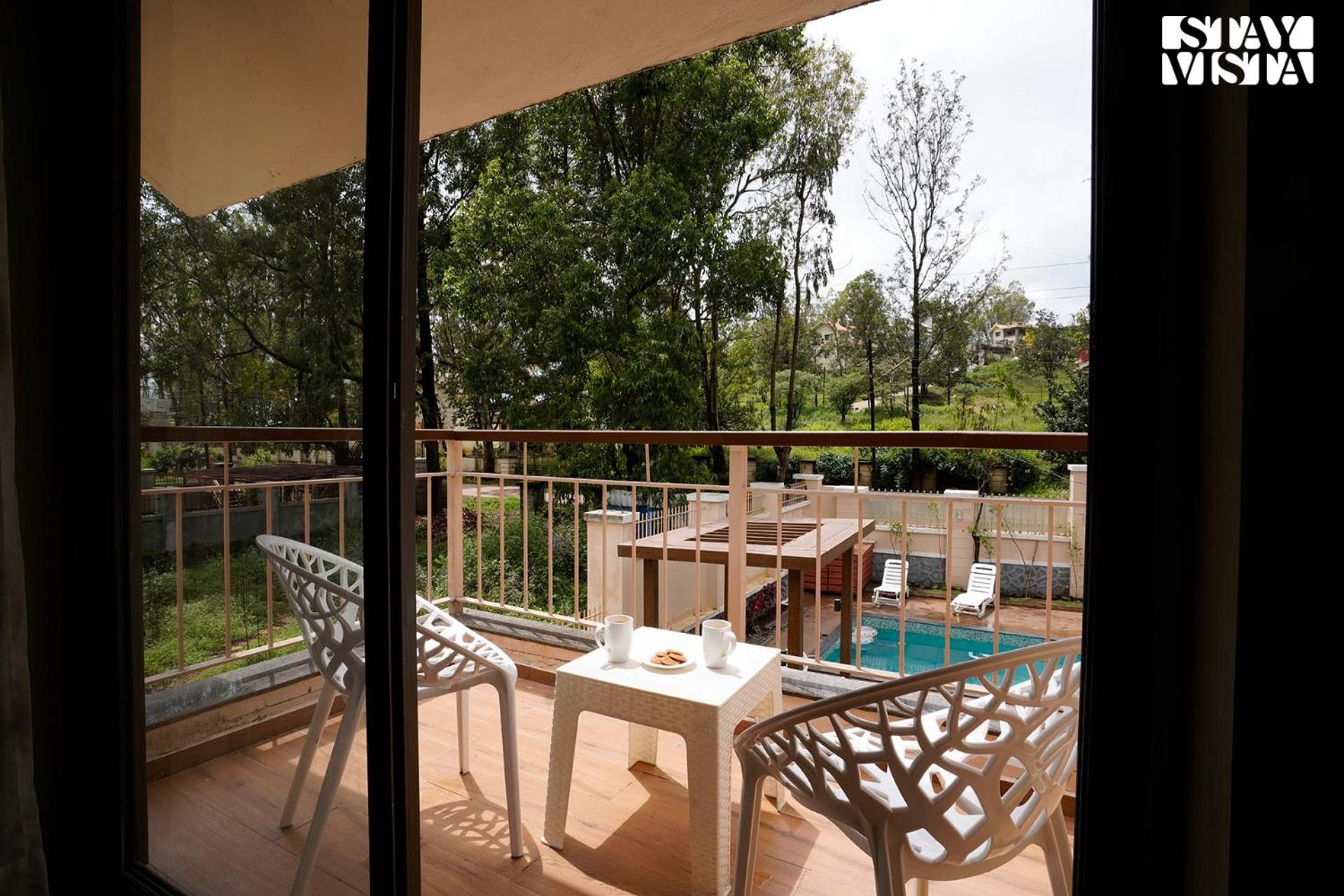 StayVista's Skylight Serenity with Modern Interiors, Outdoor Pool, Poolside Gazebo, Manicured Lawn