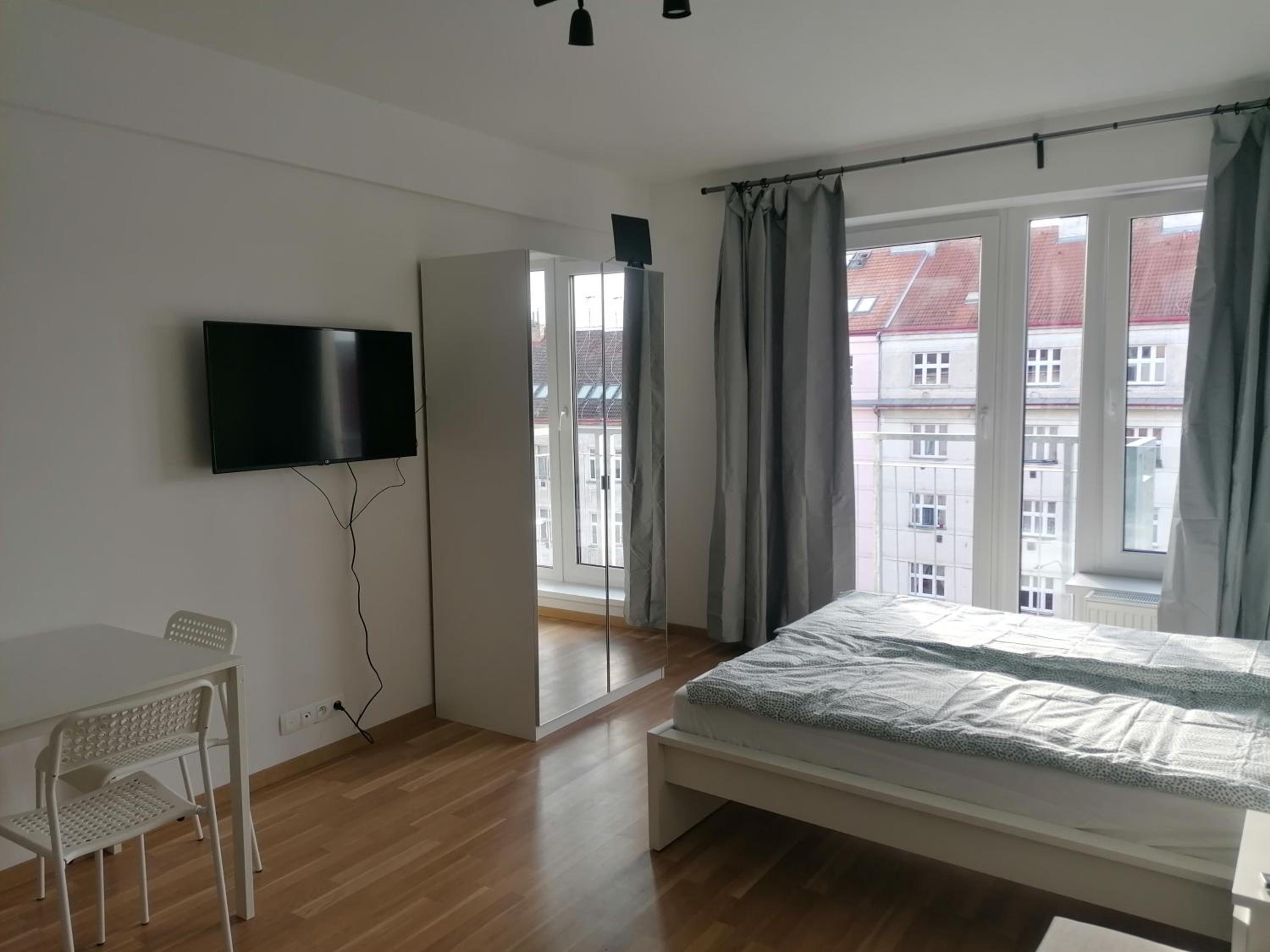 Brand new studio apartment #71 with free secure parking in the center