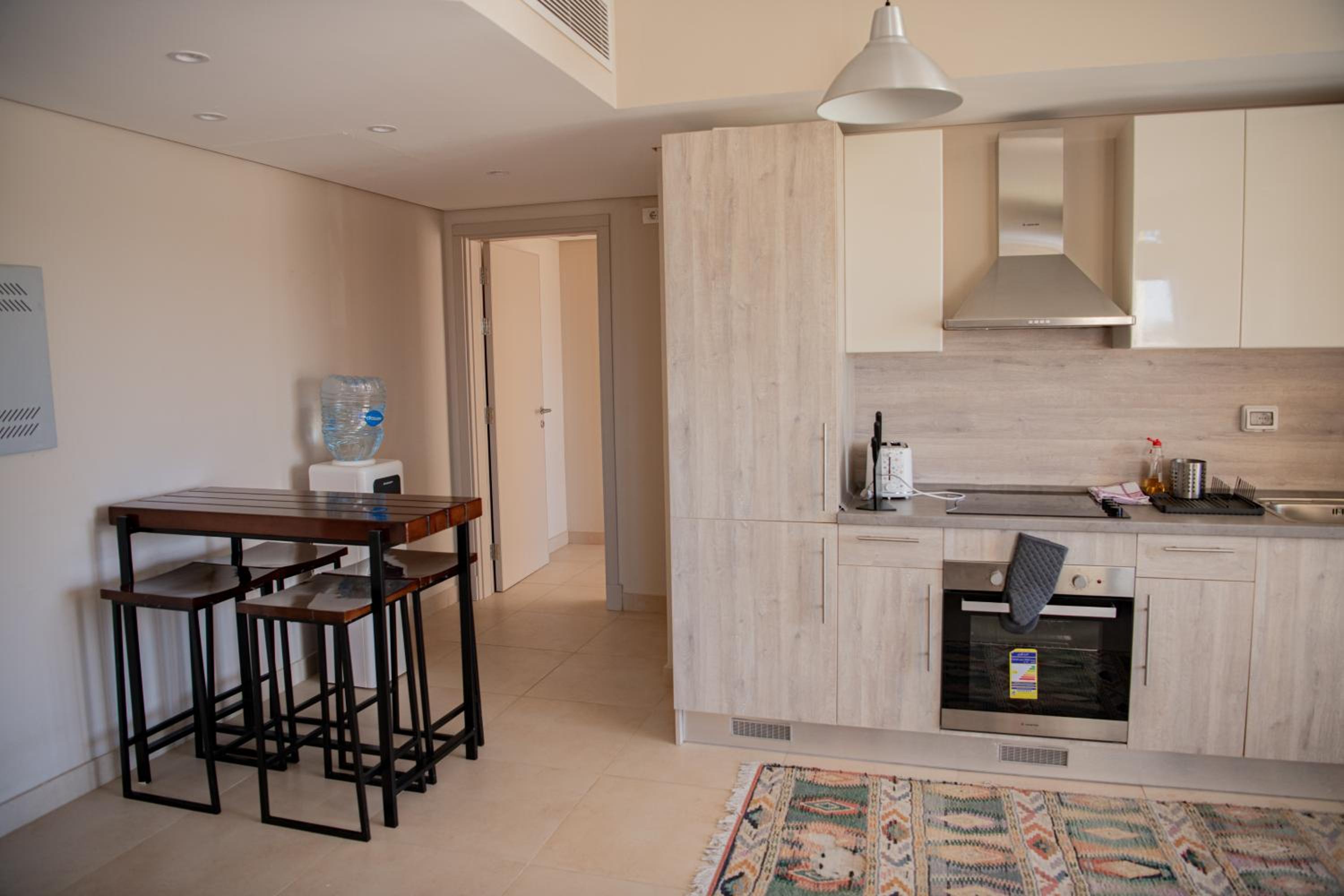 Modern apartment with large pool & beach access view 2