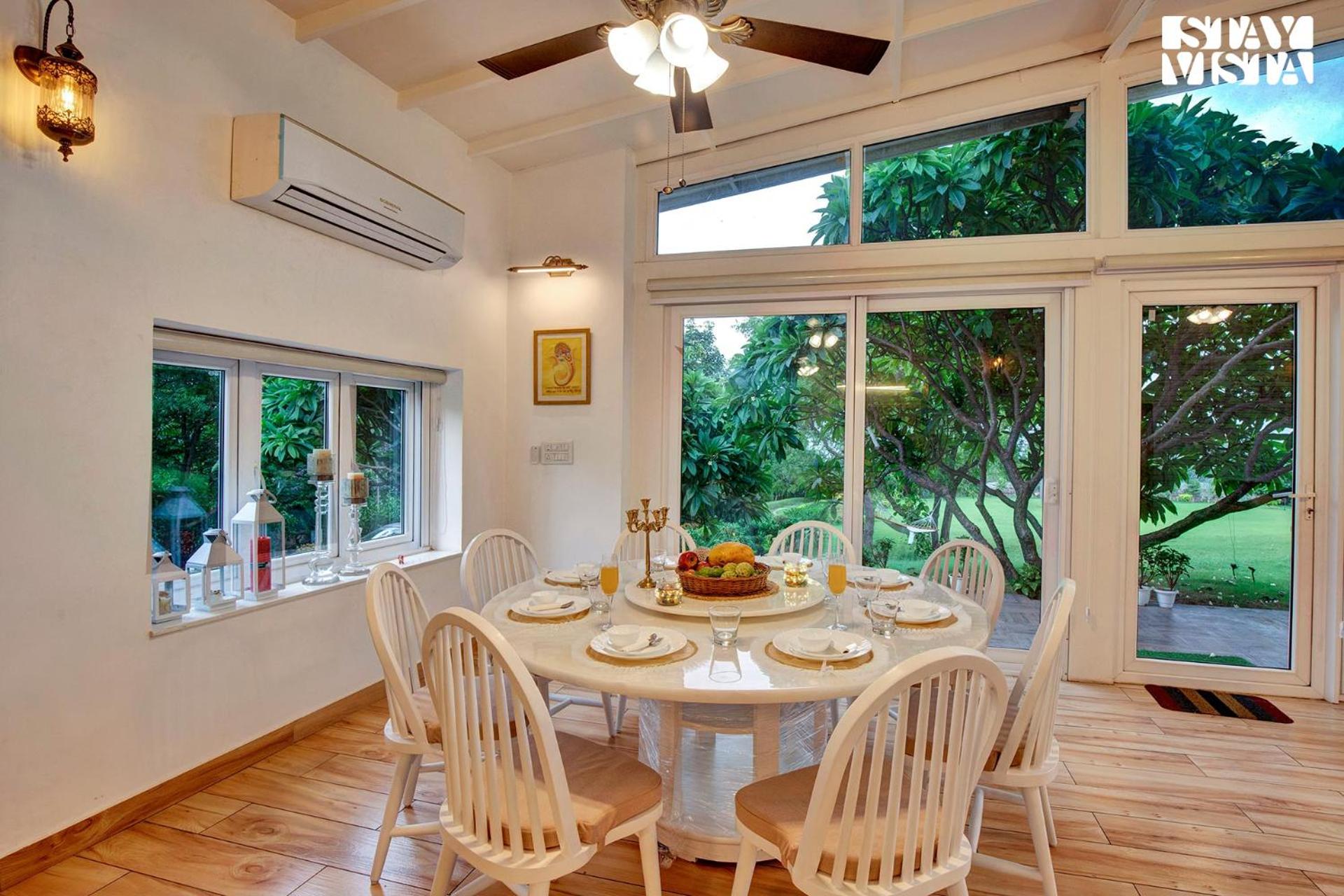 StayVista at Idyllic Farmhouse - A Glasshouse view 5