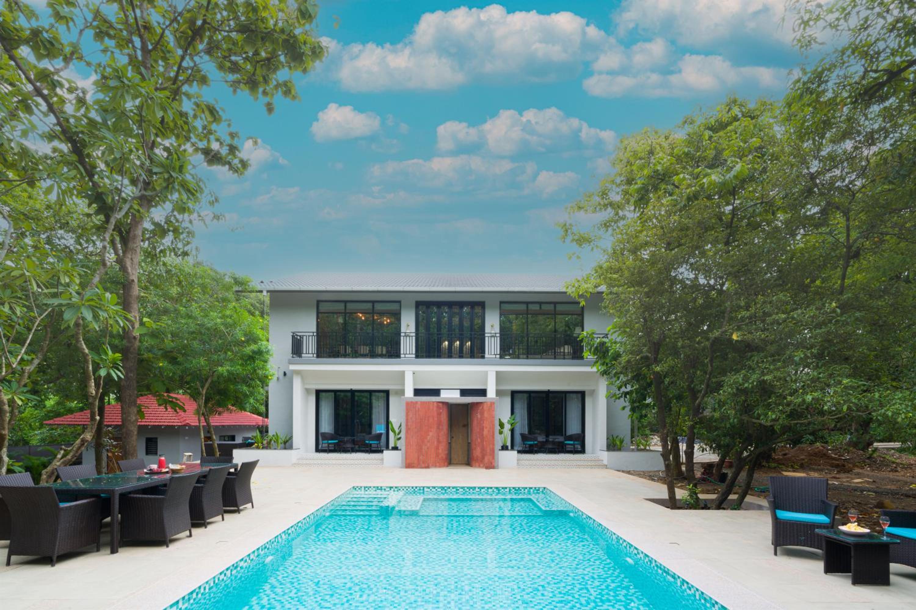 SaffronStays Arabella - 4BR bohemian pool villa with sunken lounge, foosball, PS4 & mango orchard views in Alibaug