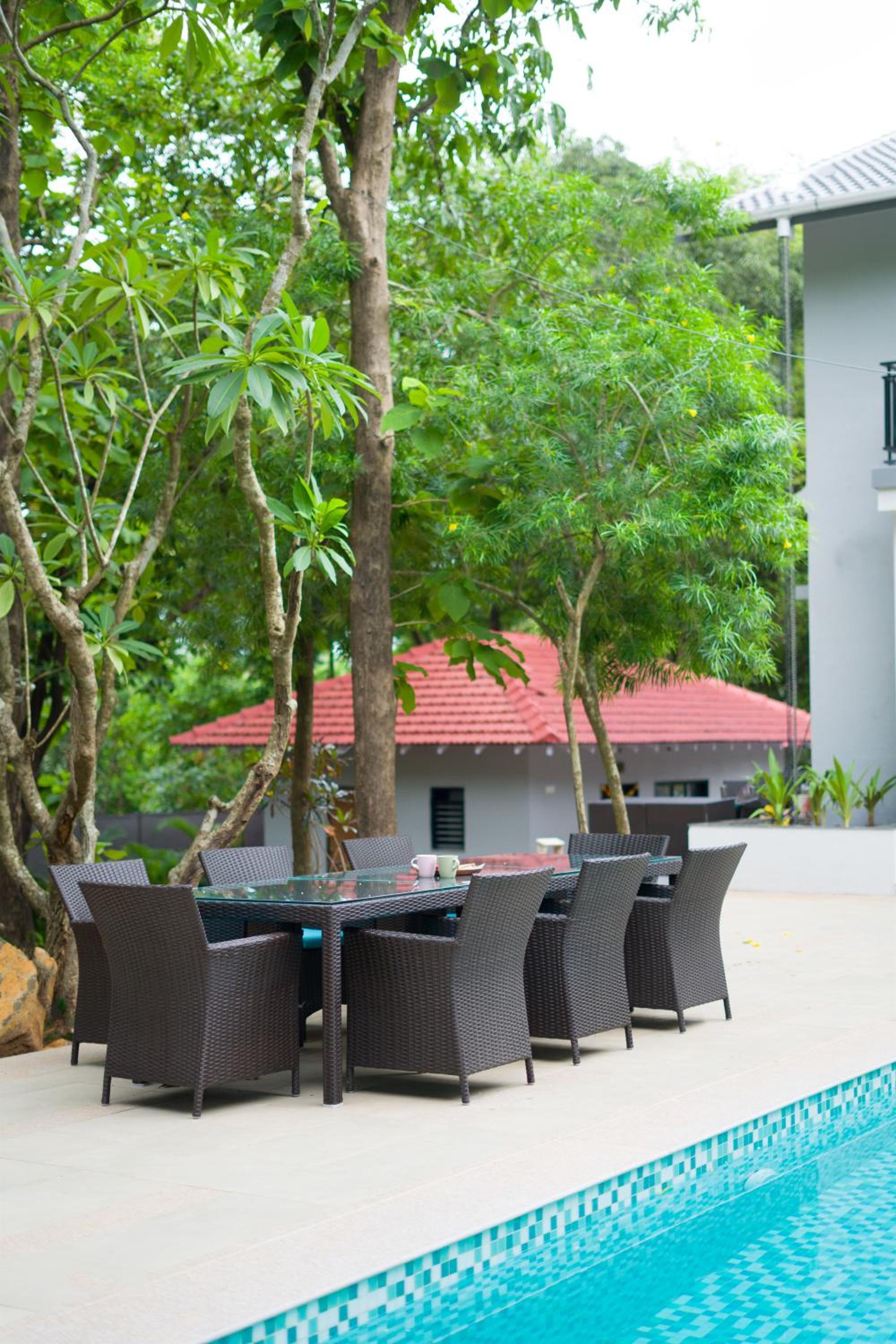 SaffronStays Arabella - 4BR bohemian pool villa with sunken lounge, foosball, PS4 & mango orchard views in Alibaug