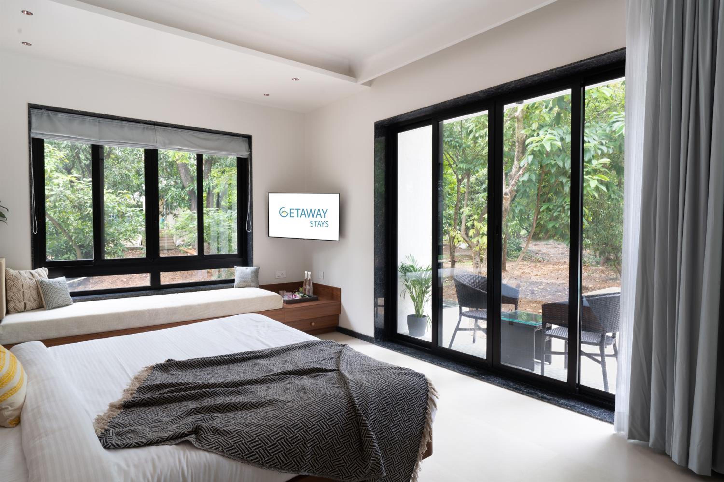 SaffronStays Arabella - 4BR bohemian pool villa with sunken lounge, foosball, PS4 & mango orchard views in Alibaug